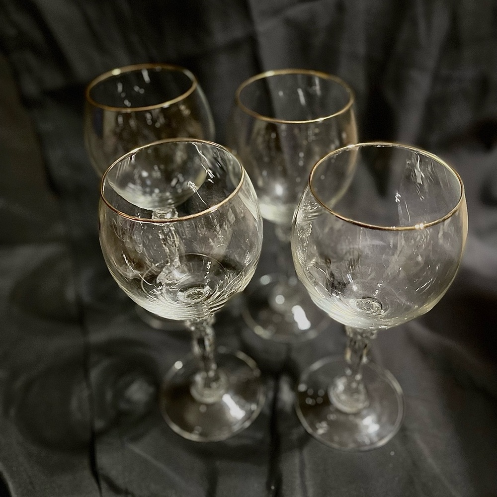 Set of 4 gold rimmed crystal wine glasses